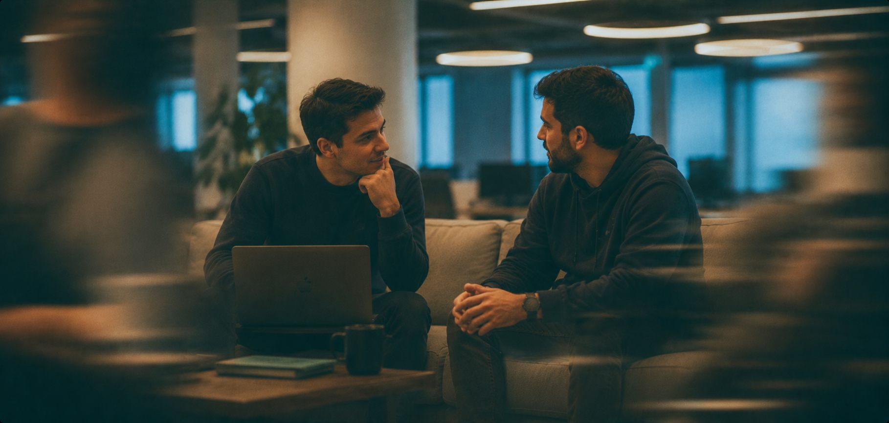 Two Loonar engineers talking through a problem in the office